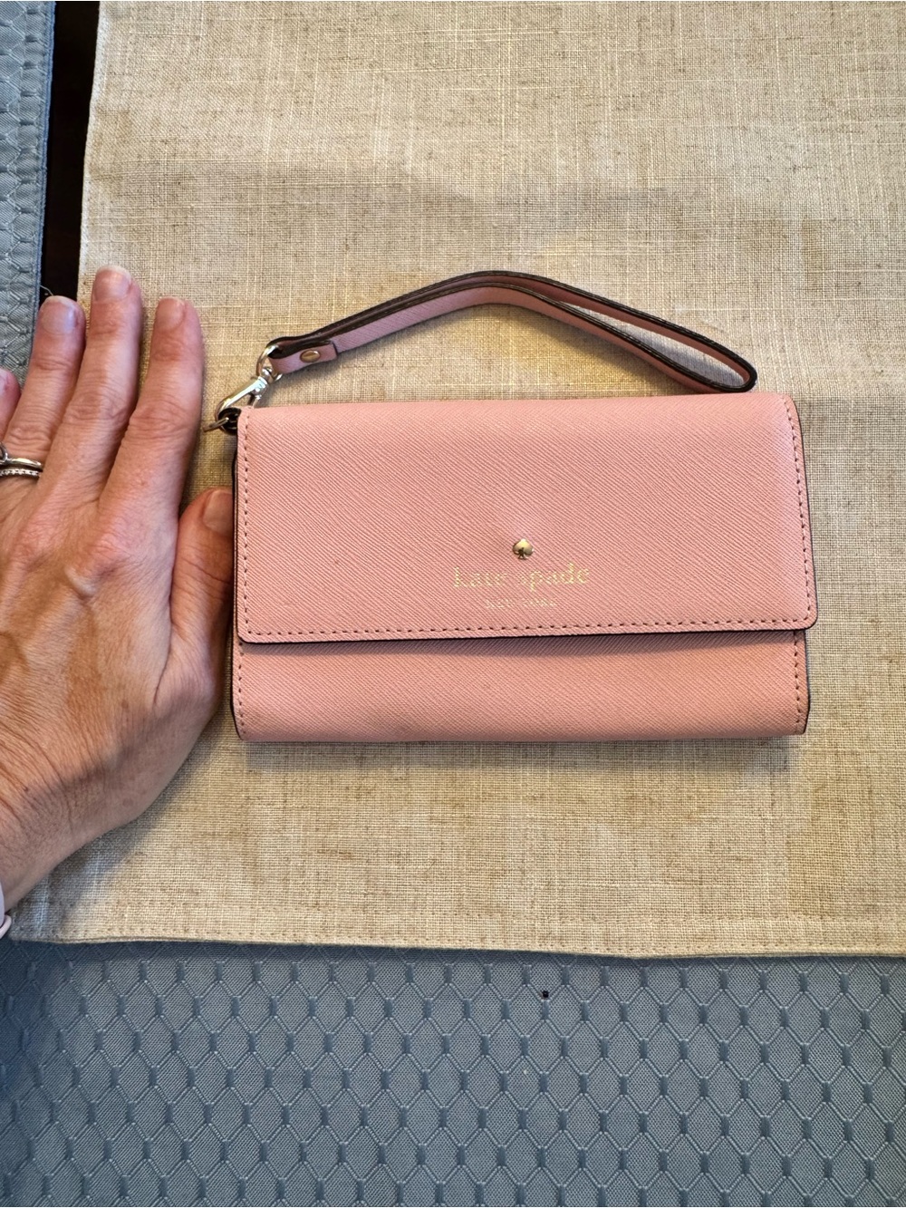 kate spade pink Saffiano leather wristlet clutch with gold logo
